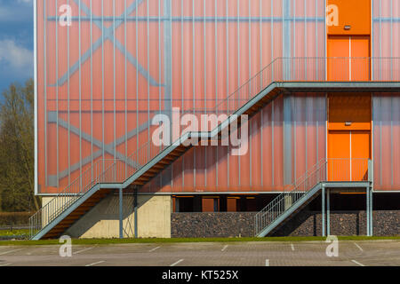 Modern building facade with Emergency exit escape ladder on the exterior Stock Photo