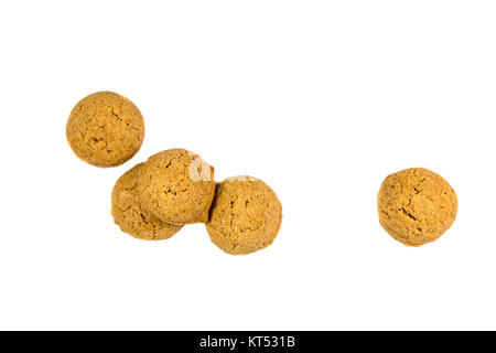 Five scattered Pepernoten cookies or ginger nuts from above as Sinterklaas decoration on white background for dutch sinterklaasfeest holiday event on  Stock Photo