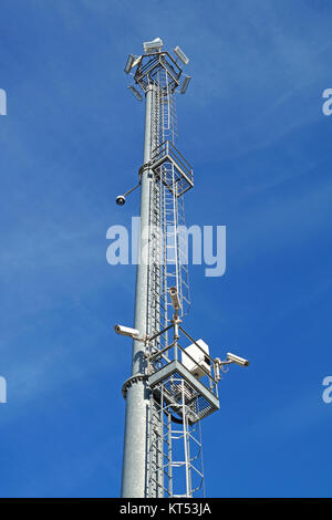 Surveillance cameras and modern lighting fixtures on the lamppost . Stock Photo