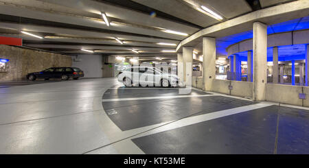 Modern Underground circular parking garage with parked cars Stock Photo