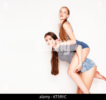 Two Cute Teenagers Having Fun Together Isolated On White, Girls Friends  Stock Photo, Picture and Royalty Free Image. Image 45663852.