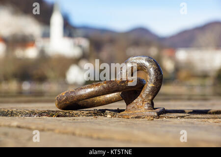 Large metal hooks on quay for mooring boats, Stock Photo