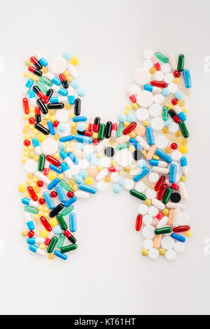 Top view of letter H made from medical pills and capsules, medicine and healthcare concept Stock Photo