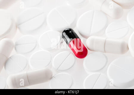 close up view of medical pills and capsules on white