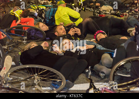 Green Party Mayoral candidate Sian Berry (centre) takes part in the No More Coffins Die-In for safer streets by Stop Killing Cyclists outside TfL's HQ in London. She supports the demand for 10% of TfL's budget to support safer cycling. Stock Photo