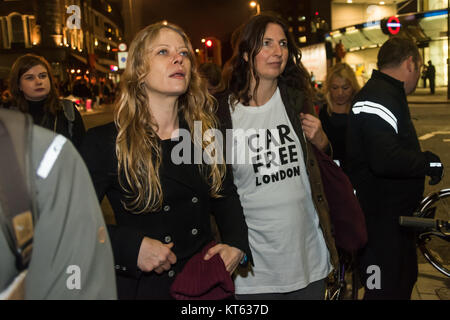 Green Party Mayoral candidate Sian Berry (centre left) with others at the No More Coffins Die-In for safer streets by Stop Killing Cyclists outside TfL's HQ in London. She supports the demand for 10% of TfL's budget to support safer cycling. Stock Photo