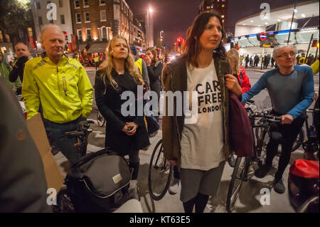 Green Party Mayoral candidate Sian Berry (centre left) with others at the No More Coffins Die-In for safer streets by Stop Killing Cyclists outside TfL's HQ in London. She supports the demand for 10% of TfL's budget to support safer cycling. Stock Photo