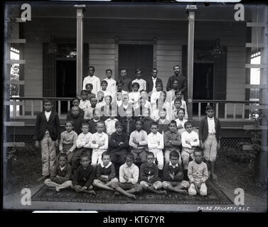 This photograph, taken by Brother Bertram, depicts a class of third-grade students at Saint Louis College. It provides a glimpse into mid-20th-century education, showcasing the students in their school environment. Stock Photo