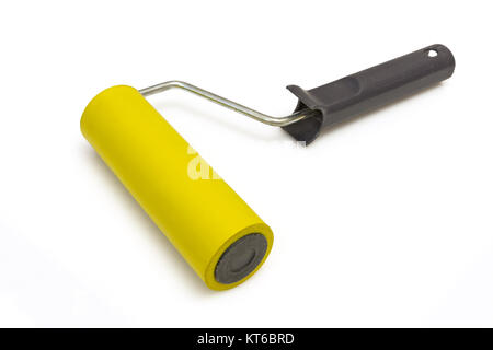 Yellow rubber paint roller on a white background Stock Photo
