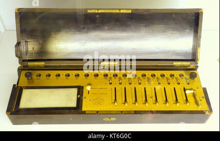 The Arithmometer, designed by Charles Xavier Thomas in the early 19th century, is one of the first mechanical calculators. Produced between 1866-1870, this device was used for performing basic arithmetic operations. It is now housed in the Tekniska Museet in Stockholm, Sweden. Stock Photo