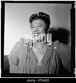 This portrait of Ella Fitzgerald, taken in New York around November 1946, captures the renowned American jazz singer in her prime. Fitzgerald, celebrated for her extraordinary vocal ability and jazz influence, is one of the most iconic figures in the history of music. Stock Photo