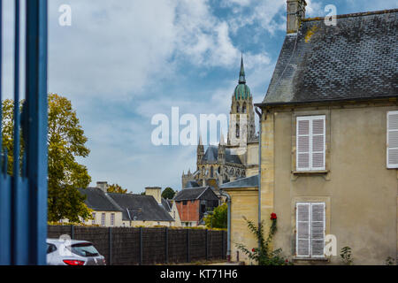 The Gothic-Romanesque Bayeux Cathedral, or Cathedral of Our Lady of Bayeux in Bayeux France, from a distance Stock Photo