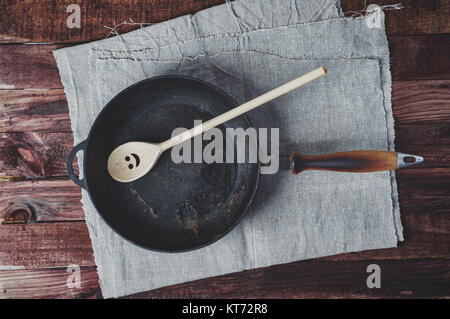 Frying pan frying pans and a wooden paddle Stock Photo