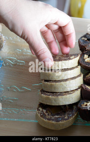 Colorful and delicious home made small cakes arranged on glass plate Stock Photo