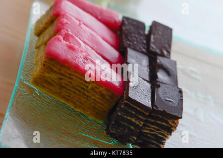 Colorful and delicious chocolate home made small cakes arranged on glass plate Stock Photo