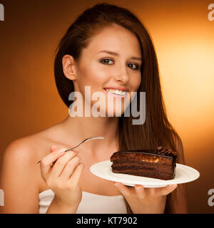 chocolate cake - glamorous woman eats dessert Stock Photo