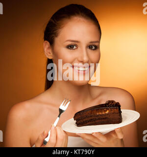 chocolate cake - glamorous woman eats dessert Stock Photo