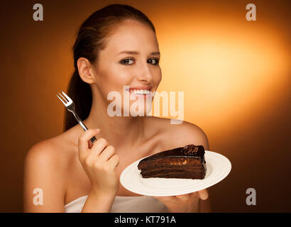 chocolate cake - glamorous woman eats dessert Stock Photo