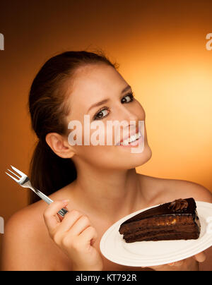 chocolate cake - glamorous woman eats dessert Stock Photo