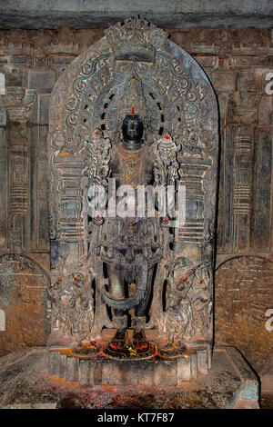 Sun God statue in black stone inside the shrine. Hoysaleswara Temple, Hoysala style, Halebidu, Karnataka, South India, Stock Photo