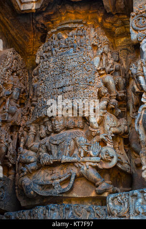 Ravana lifting Mount Kailasha. Shiva and Parvati at the top. Hoysalesvara Temple, Halebid, Karnataka, 12th Century. Shiva temple Stock Photo