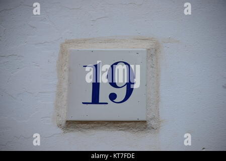 house facades,street signs,email,tiles,spain,alicante province,house number 19 Stock Photo