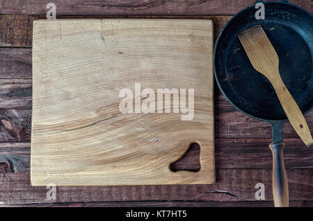 large wooden cutting board on brown surface Stock Photo