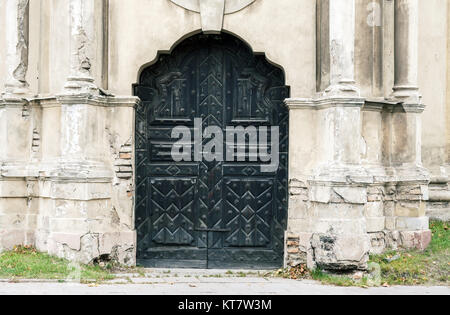 Abandoned decorative church doors Stock Photo