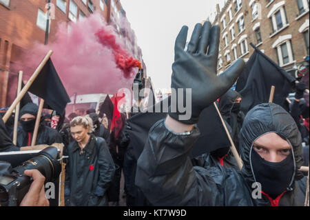 Black bloc students let of several smoke flares on the NCAFC Student march for free education - No Barriers, No Borders, No Business. Stock Photo