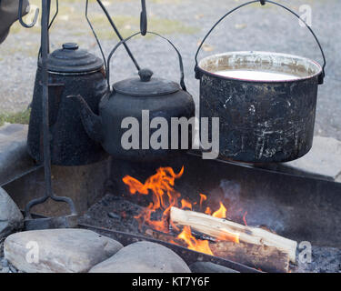 coffee pot boiling over an open fire cowboy flame smoke caffine wild west  Stock Photo - Alamy