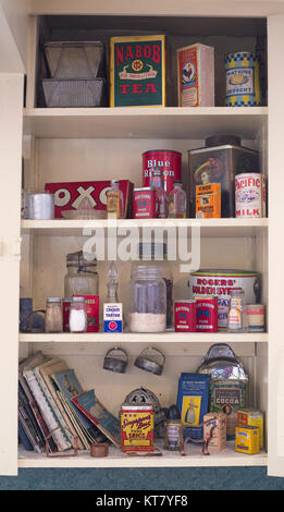 Display of canned foods, dried foods and spices on shelves in cookhouse at Bar U Ranch National Historic Site, western Canada Stock Photo