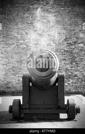 Vintage Cannon Resting Outdoors Stock Photo