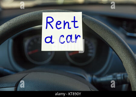 Rental Car Concept On Steering Wheel Stock Photo