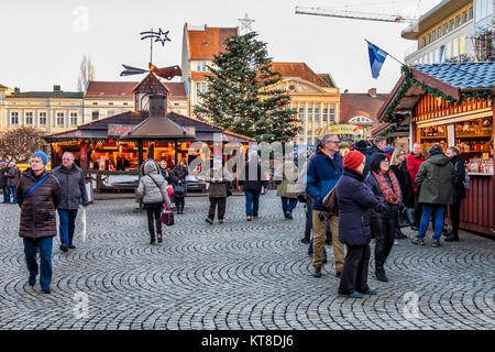 Berlin Spandau.People enjoy typical Traditional German Christmas market stalls in cobbled Old Town Street Stock Photo