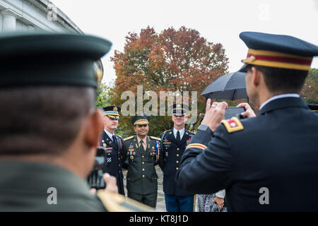 From left: Col. Jason Garkey, commander, 3d Infantry Regiment (Old Guard); Brig. Gen. Pedro Pablo Hurtado, deputy commander, Dominican Republic Army; and Maj. Scott Beeson, command sergeant, 3d Infantry Regiment (Old Guard) pose for a photo outside of the Memorial Amphitheater at Arlington National Cemetery, Arlington, Virginia, Nov. 9, 2017.  Earlier, Hurtado and participated in an Army Full Honors Wreath-Laying Ceremony on behalf of the Conference of the American Armies at the Tomb of the Unknown Soldie.r (U.S. Army photo by Elizabeth Fraser / Arlington National Cemetery / released) Stock Photo