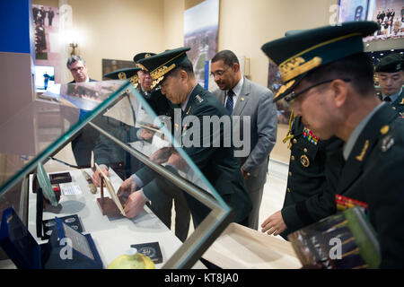 Gen. Jang Jun Gyu, Chief of Staff Republic of Korea Army, places a gift for Arlington National Cemetery in a display case in the Memorial Amphitheater Display Room April 12, 2016, in Arlington, Va. Gen. Jang also laid a wreath at the Tomb of the Unknown Soldier and visited the grave of Gen. Walton Walker. (U.S. Army photo by Rachel Larue/Arlington National Cemetery/released) Stock Photo