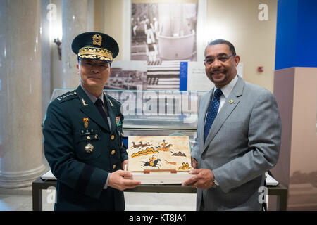 Gen. Jang Jun Gyu, left, Chief of Staff Republic of Korea Army, poses for a photograph with Deputy Superintendent for Cemetery Operations Brion Moore in the Memorial Amphitheater Display Room April 12, 2016, in Arlington, Va. Gen. Jang also laid a wreath at the Tomb of the Unknown Soldier and visited the grave of Gen. Walton Walker. (U.S. Army photo by Rachel Larue/Arlington National Cemetery/released) Stock Photo