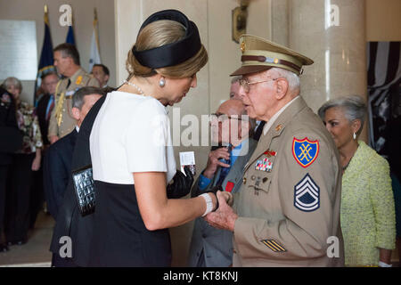 Her Majesty Queen Máxima of the Netherlands meets with World War II and Korean War veteran Don Bertino in the Memorial Display Room in Arlington National Cemetery, June 1, 2015, in Arlington, Va. The royal couple laid a wreath at the Tomb of the Unknown Soldier and then met with veterans and women who worked as “Rosies” during World War II. (U.S. Army photo by Rachel Larue) Stock Photo