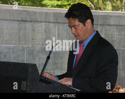 Turner Kobayashi gives welcome remarks during the Japanese American Citizens League and the Japanese American Veterans Association’s annual Memorial Day Service in the Columbarium Courtyard at Arlington National Cemetery, May 24, 2015, in Arlington, Va. The service has been conducted for 67 years. (U.S. Army Photo by Rachel Larue/released) Stock Photo