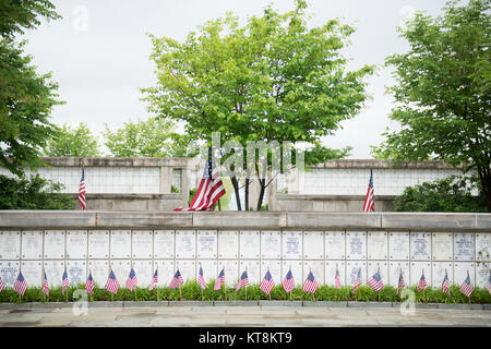 American flags are placed in the Columbarium in Arlington National Cemetery during “Flags in,” May 21, 2015, in Arlington, Va. During “Flags in” The Old Guard places 228,000 flags at every headstone. (U.S. Army photo by Rachel Larue/released) Stock Photo