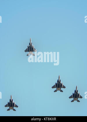 U.S. Air Force F-15E Strike Eagle aircraft fly overhead during the funeral for retired Air Force Gen. David C. Jones, the ninth chairman of the Joint Chiefs of Staff, at Arlington National Cemetery in Arlington, Va., Oct. 25, 2013. Current Chairman of the Joint Chiefs of Staff Army Gen. Martin E. Dempsey and Chief of Staff of the Air Force Gen. Mark A. Welsh III were among the attendees honoring Jones, who served as chairman from 1978 to 1982. He passed away Aug. 10, 2013. (DoD photo by Staff Sgt. Sean K. Harp, U.S. Army/Released) Stock Photo