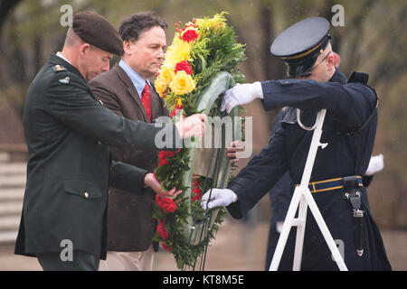 From the left, Belgian Army Col. Roger Housen and Belgian Duke of Arenberg lay a wreath at the Tomb of the Unknown Soldier in Arlington National Cemetery, April 14, 2015, in Arlington, Va. The note on the wreath reads, “In remembrance of the American troops, among others, Colonel Albert Metts, who liberated my mother, Princess Sophie, and her family, the royal family of Bavaria, from the Nazi death camps Oranienburg-Flossenburg-Dachau in May 1945. Duke Leopold of Arenberg.” (Arlington National Cemetery photo by Rachel Larue) Stock Photo