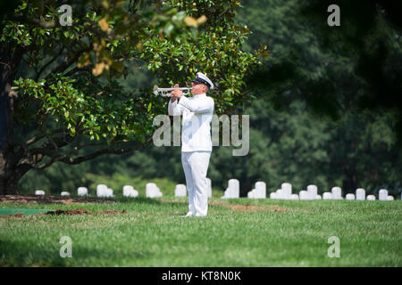 A bugler from the U.S. Navy Band, plays taps during the graveside service for U.S. Navy Fire Controlman Chief Gary Leo Rehm Jr. at Arlington National Cemetery, Arlington, Va, Aug. 16, 2017. Rehm perished when the USS Fitzgerald (DDG 62) was involved in a collision with the Philippine-flagged merchant vessel ACX Crystal on June 17, 2017. U.S. Navy posthumously promoted Rehm to Fire Controlman Chief in a ceremony earlier in the week. (U.S. Army photo by Elizabeth Fraser / Arlington National Cemetery / released) Stock Photo