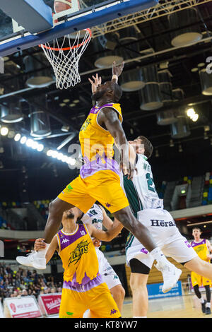 Copper Box Arena, London, 22nd Dec 2017. Lions Paul Guede (12) shoots for a point. Tensions run high in the British Basketball League game between the home team London Lions and guests Plymouth Raiders. Lions win 95-67. Credit: Imageplotter News and Sports/Alamy Live News Stock Photo