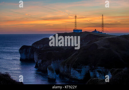 Flamborough, East Yorkshire, UK. 23rd Dec, 2017. Flamborough Head and LightHouse in the Morning Light and Sunrise.Flamborough Head is a promontory, 8 miles (13 km) long on the Yorkshire coast of England, between the Filey and Bridlington bays of the North Sea. It is a chalk headland, with sheer white cliffs. The cliff top has two standing lighthouse towers, the oldest dating from 1669 and Flamborough Head Lighthouse built in 1806. Credit: ZUMA Press, Inc./Alamy Live News Stock Photo