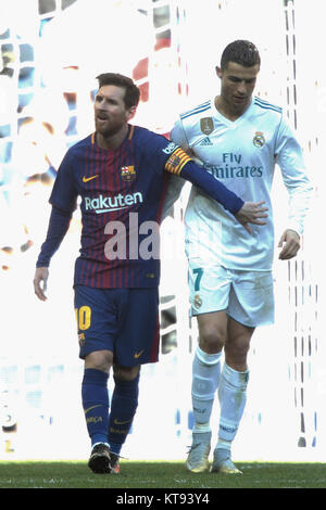 Madrid, Spain. 23rd Dec, 2017. Real Madrid's Cristiano Ronaldo (R) and Barcelona's Lionel Messi walk side by side at the end of the Spanish La Liga soccer match between Real Madrid and Barcelona at the Santiago Bernabeu stadium in Madrid, Spain, on Dec. 23, 2017. Barcelona beat Real Madrid by 3-0. Credit: Juan Carlos Rojas/Xinhua/Alamy Live News Stock Photo