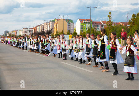 NOVI SAD, SERBIA-OCT 4, 2015: Guinness World Record Largest Folk Dance on Oct 4. 2015 in Novi Sad, Serbia. Over 12.000 participants break the Guinness Stock Photo