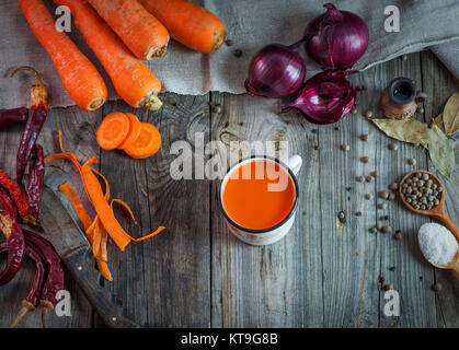 Juice in a mug on a gray wooden surface Stock Photo