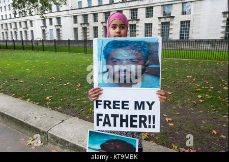 Zainab Omar (10) at the protest for Shaker Aamer holds a poster for the release of her father Shawki Ahmed Omar,held by the US in Iraq in 2004, tortured and still in an Iraqi jail. She was born after his arrest and has never seen her father. Stock Photo