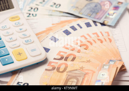 Calculator and euro money on a table desk Stock Photo